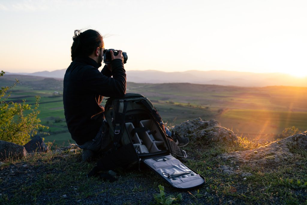 Ambassador Sasan Amir photographing the Sunset with the Ajna DuraDiamond with open Backpanel next to him 