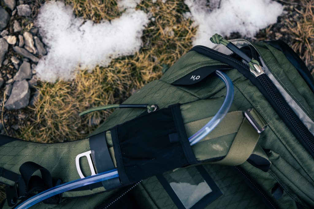 H2O Hydration hole with Water bladder tube shown on the Tilopa DuraDiamond in cypress