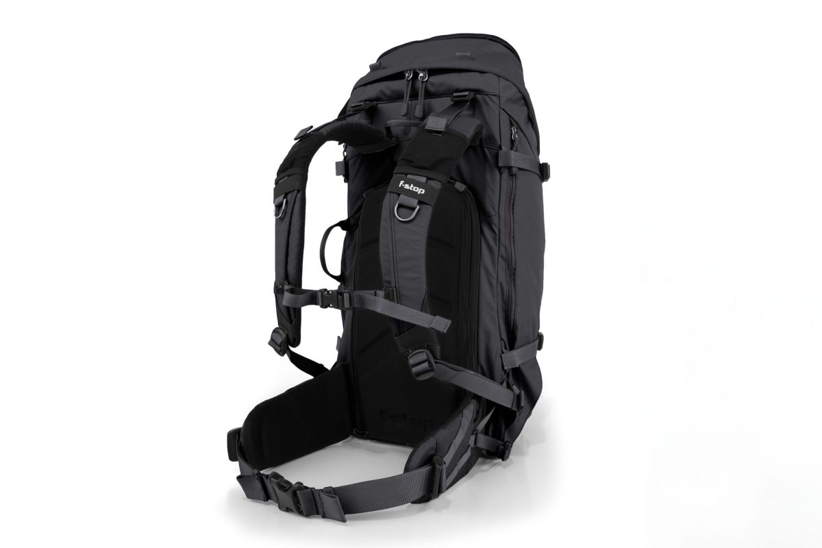 f-stop Sukha 70 liter camera backpack in the Anthracite Black color viewed from the side and back