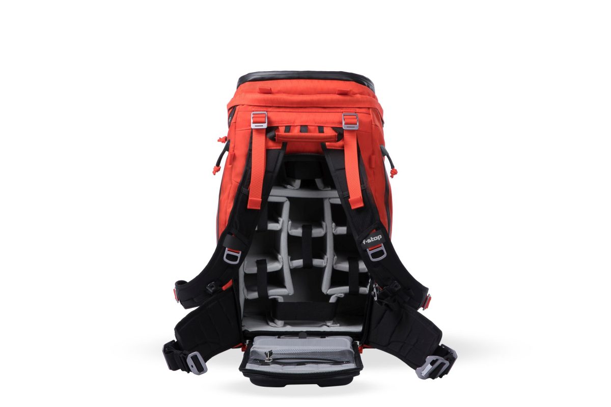 f-stop Tilopa 50 liter DuraDiamond® camera backpack in the Magma Red color option with the back panel open showing a Pro Large Camera Insert inside