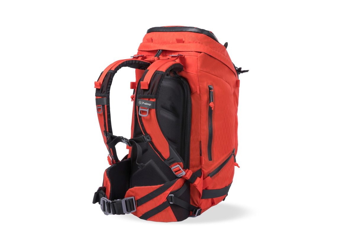 f-stop Tilopa 50 liter DuraDiamond® camera backpack in the Magma Red color option viewed from the back and side