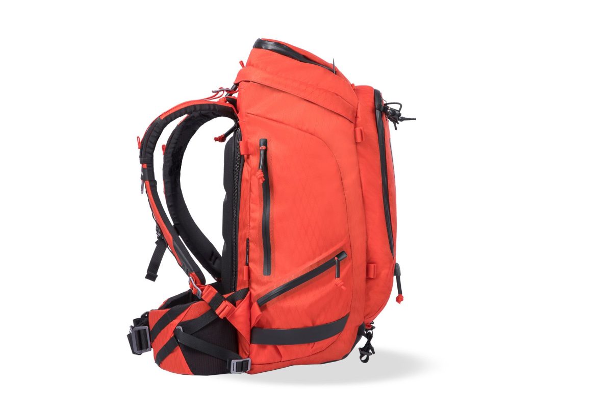 f-stop Tilopa 50 liter DuraDiamond® camera backpack in the Magma Red color option viewed from the side