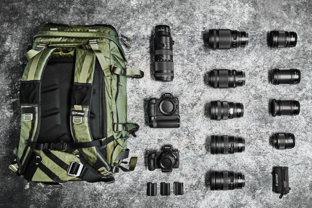 Flat lay image of the f-stop Tilopa 50 liter DuraDiamond® outdoor adventure camera backpack with Nikon Z6ii camera and lenses taken by f-stop Ambassador Nick Leavesley